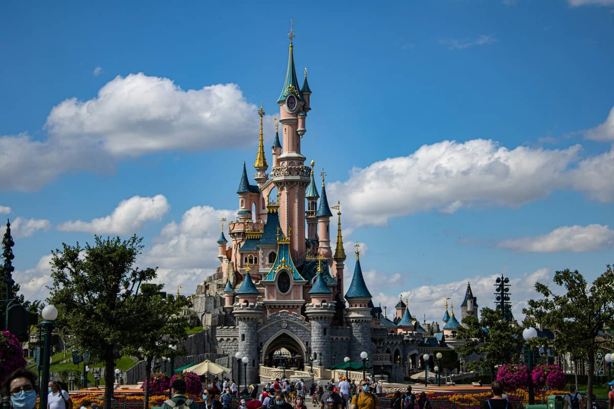 Sleeping Beauty Castle at Disneyland Paris under bright blue sky